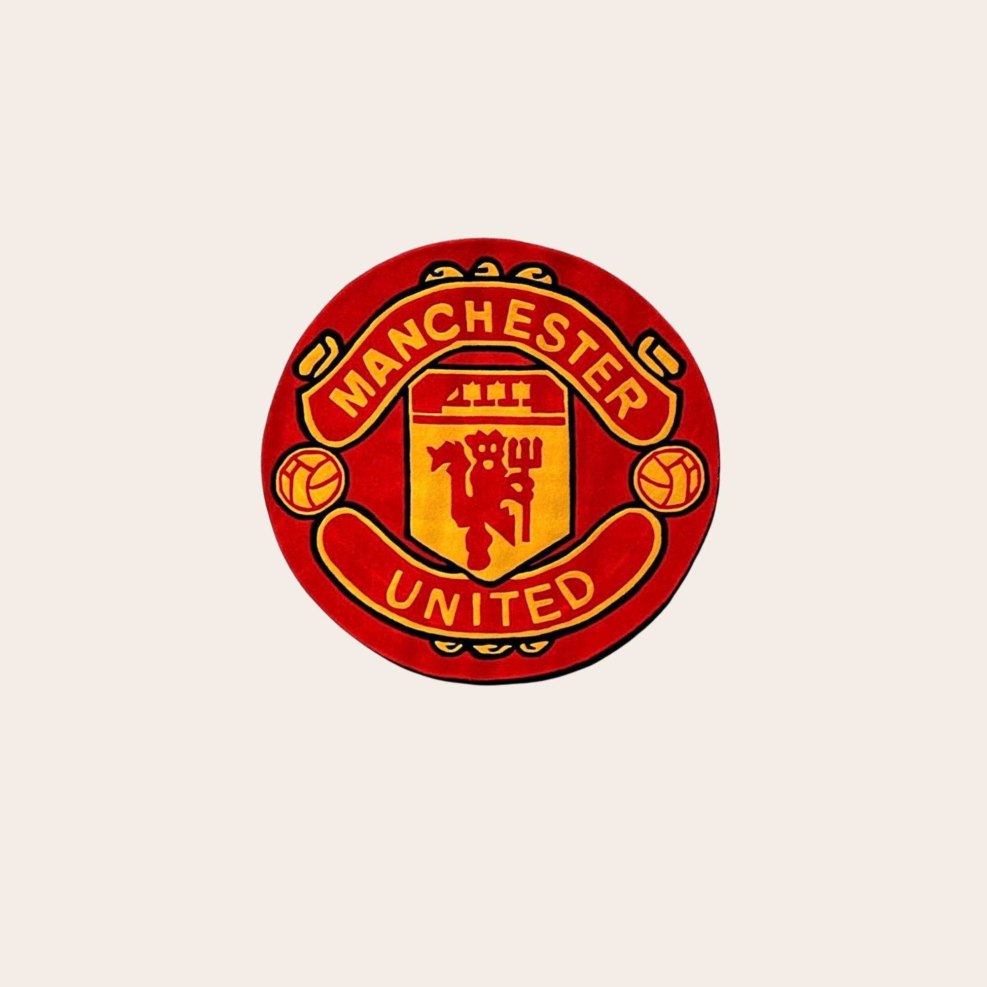 Tufted rug featuring the Manchester United logo — tapis tufting représentant le logo de Manchester United